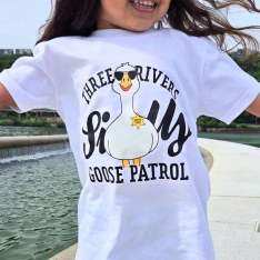White shirt with a goose graphic that says three rivers silly goose patrol